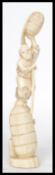 A late 19th century Oriental Japanese ivory carving carved figurine Okimono of a Merchant man trader