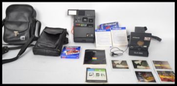 A vintage collectable 20th century Polaroid SLR 680 camera with 3 packs of films together with a