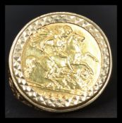 A vintage 20th century half sovereign ring having a 1982 Elizabeth 2nd half sovereign coin set