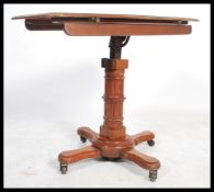 A 19th century Victorian adjustable double sided mahogany reading table lecturn by John Carter of