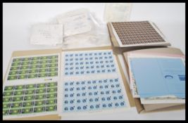 A collection of commemorative stamps and decimal books of stamps, sheets of stamps commemorating