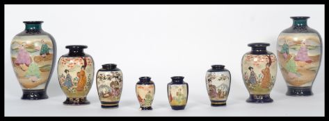 A collection of Japanese Kutani vases to include a pair of baluster vases with scenes of Geisha