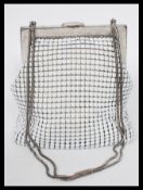 A vintage 20th century Oraton West German handbag with matching belt. The bag having original mirror