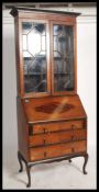 A vintage 20th century mahogany inlaid bureau bookcase, astragal glazed upper section over a fall