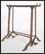 A pair of early 20th century workmens cast metal trestle ends - coffine stands ideal for
