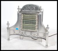 A fabulous mid 20th century silvered  electric bar fire by belling having polished steel finish with