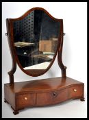 A 19th century  Georgian mahogany inlaid dressing table swing mirror being raised on a serpentine
