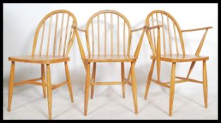 A set of 3 original mid century Ercol - CC41 utility beech wood carver dining chairs having blue