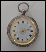 An early 20th continental silver pocket watch bearing London import silver marks. The white enamel