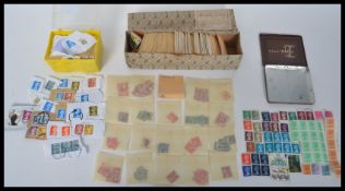 A collection of vintage 20th century World stamps to include unused stamps, kiloware and a box of