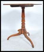 A 19th century Georgian mahogay tilt top wine / occasional side table. Raised on a tripod base