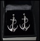 A pair of sterling silver earrings in the form of anchors with rope. Complete in presentation box.