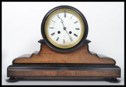 A 19th century Victorian mahogany cased mantel clock, set with an eight day movement, enamel face,