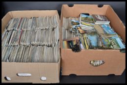Massive postcard hoard. Several thousands crammed into two banana boxes plus some loose.Ex house