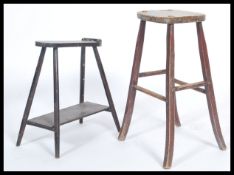 An early 20th century shoe shine foot rest together with similar stool, both raised on turned legs