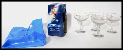 A set of four vintage 20th century Babycham white fawn advertising glasses together with a four