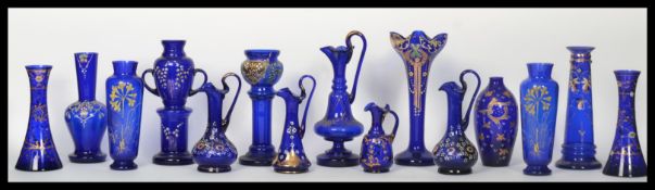 A collection of fourteen Bohemian blue glass dating from the 19th century to include ewer jugs ,