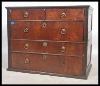 An 18th country oak and mahogany chest of drawers. The chest with two short drawers over deep fitted