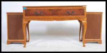 A vintage 20th century a mahogany and burr walnut quarter panel veneer radiogram stereo-gram