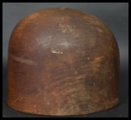 A late 19th century early 20th century wooden turned  millinery hat block height