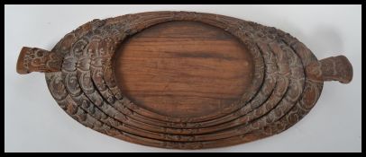 A set of 20th century asiatic hardwood graduating butlers serving trays. Each of lozenge form