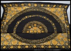 An early 20th century Indian wall hanging having a cotton back with silk threads. The design of