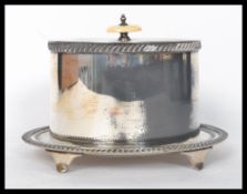 A stunning silver plated bacon warmer bearing marks for Walker and Hall to the base, raised on