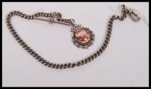 A silver metal pocket watch Albert chain together with a silver hallmarked fob medal with 9ct gold