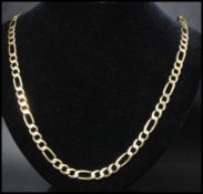 A hallmarked 9ct gold Figaro chain necklace having a lobster claw clasp. Measures 27 inches.