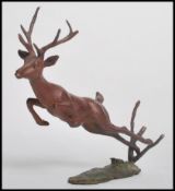 An Austrian cold painted bronze in the form of a l