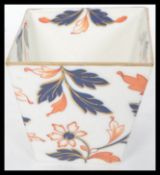 A 19th century Staffordshire ceramic small vase / bowl of tapered square form in an Imari pattern.