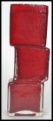 A vintage 20th century Whitefriars style studio glass  red drunken bricklayer vase in the manner