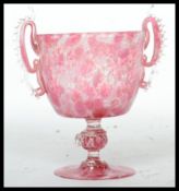 A stunning early 20th century Murano studio art twin handled mottled pink  glass chalice raised on a