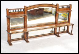 A Victorian mahogany and bone line inlaid overmantel mirror having turned column supports and