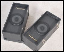 A pair of portable twin speakers by Portogram Magnat DJ speakers in carry cases having carry