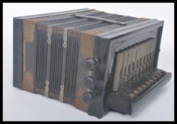 A vintage 20th century German Universe accordion musical instrument having buttons and keys.