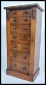 A 19th century Victorian mahogany and rosewood fronted Wellington chest of drawers. Of pedestal form