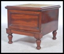 A Victorian mahogany step commode being raised on turned legs with pull out step, hinged carpet