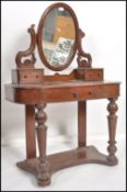 A Victorian mahogany duchess dressing table raised on turned supports with serpentine shaped