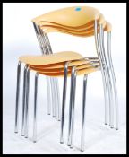 Erla sólveig óskarsdóttir - A set of four contemporary stacking Dreki chairs having yellow plastic