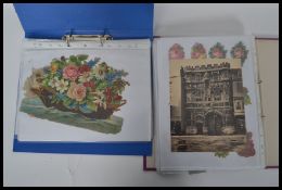 Two albums of Victorian chromolithographic scraps and later die cut and other scraps including