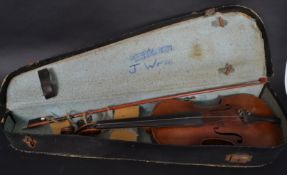 An early 20th century violin musical instrument complete with mother of pearl bow in fitted case.