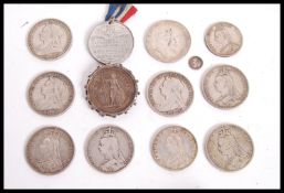 A collection of silver crowns dating from the 19th century to include 1902 1890 1889 1893 18931896