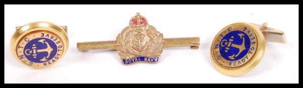 A Royal Navy bar brooch in enamel with yellow metal together with a pair of Naval cufflinks in