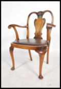 A 20th century Queen Anne revival desk / elbow office chair, being raised on cabriole legs, brown