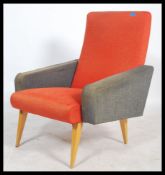 A 1960's french easy / lounge chair / armchair being of angular form upholstered in a two tone