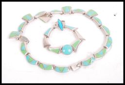 A Mexican 950 silver necklace bracelet and ring demi parure set of heavy form having inset