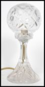 An early 20th century Edwardian cut glass table lamp. Raised on a trumpet base with faceted glass