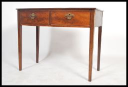 A 19th century bow fronted mahogany writing table desk being raised on square tapering legs united