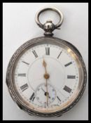 An early 20th century continental silver pocket watch. The white enamel dial having a Roman